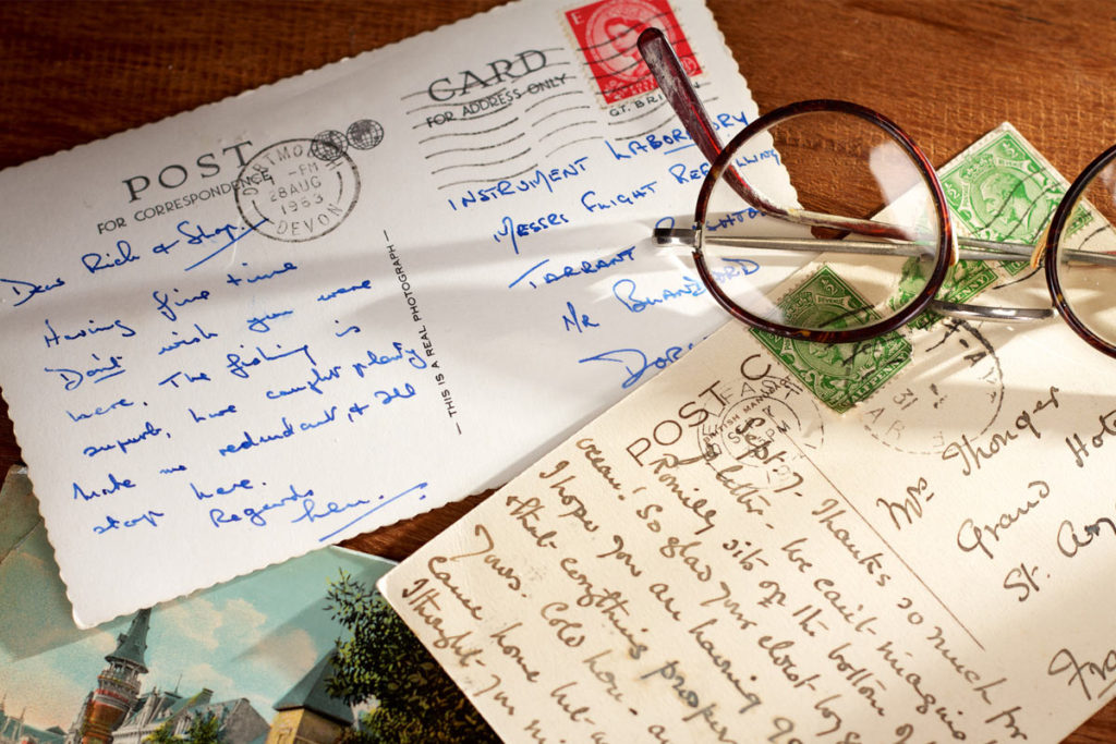 Hand-written postcards like upright on the table