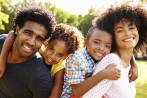 Happy family posing in the park