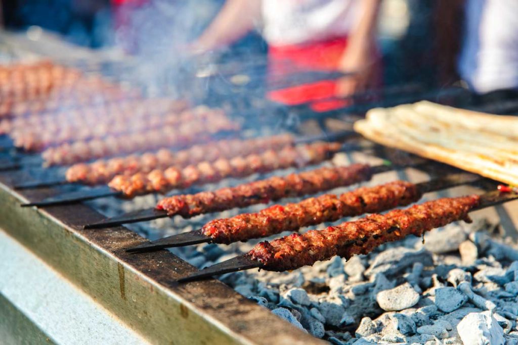 Kebab on grill with skewers in Istanbul as one of the best cities for foodies