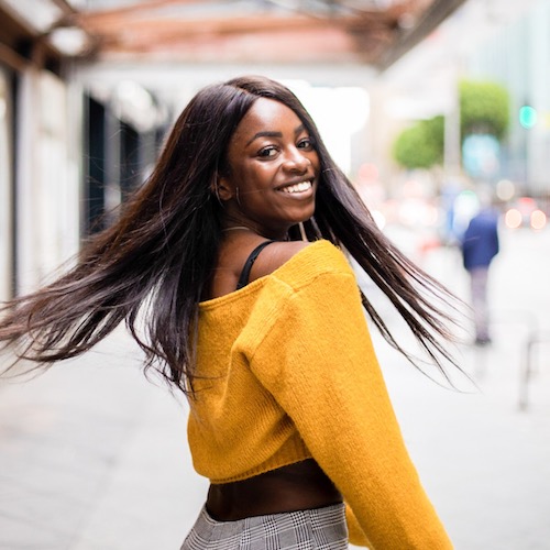 Efia Sulter abroad smiling in yellow top