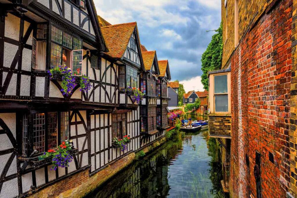Medieval buildings look over a canal in Canterbury