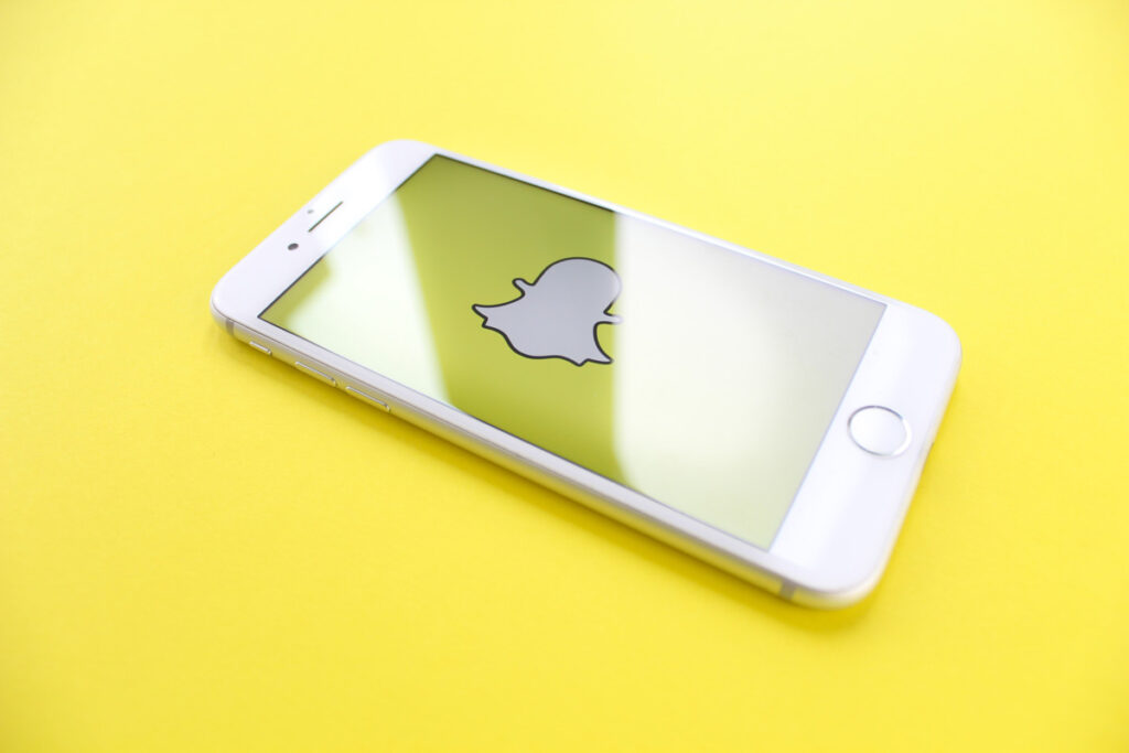 snapchat as one of the apps to stay connected on a yellow background