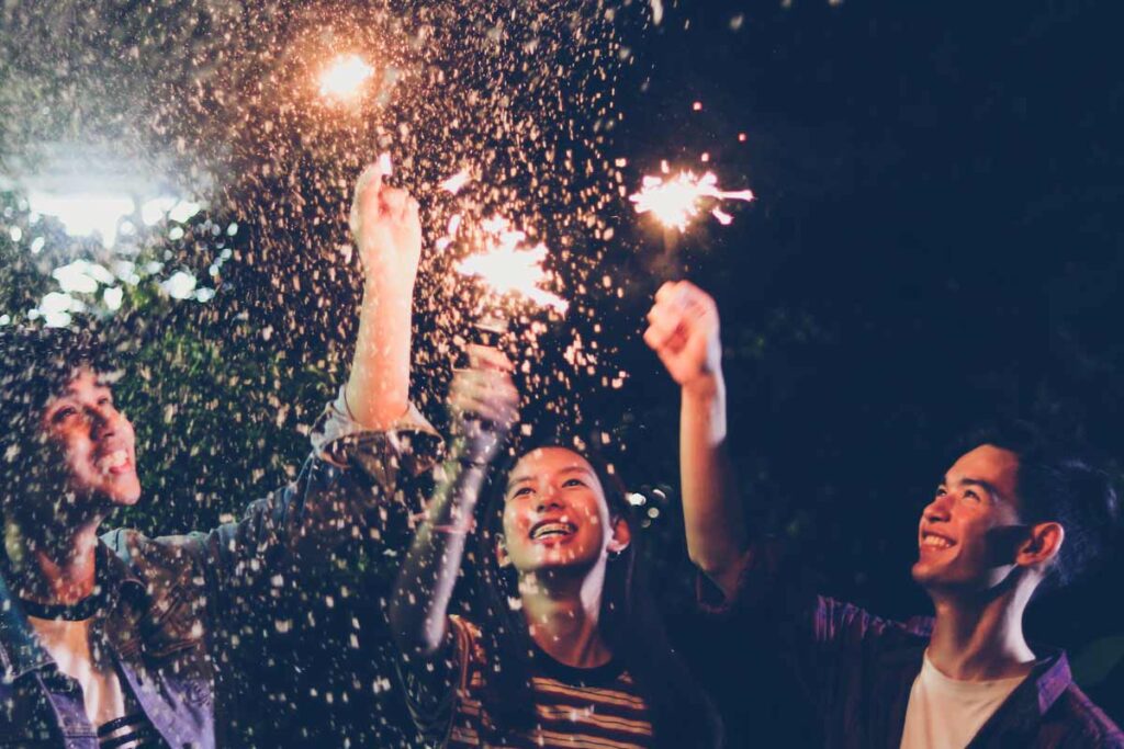 Three friends celebrate with alternative new year's eve ideas