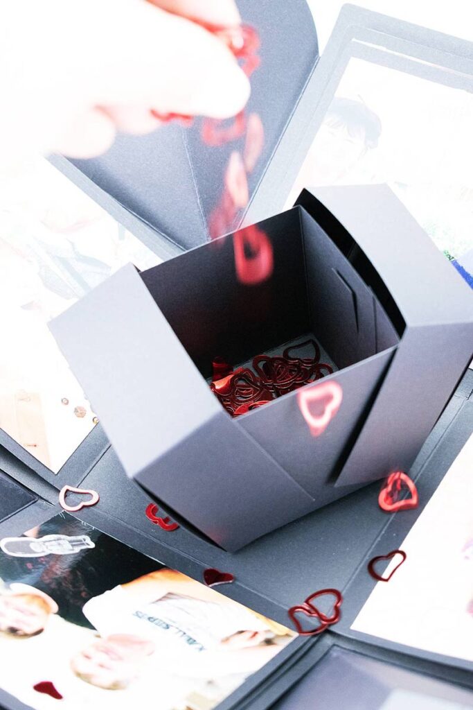 Confetti sprinkled into explosion box