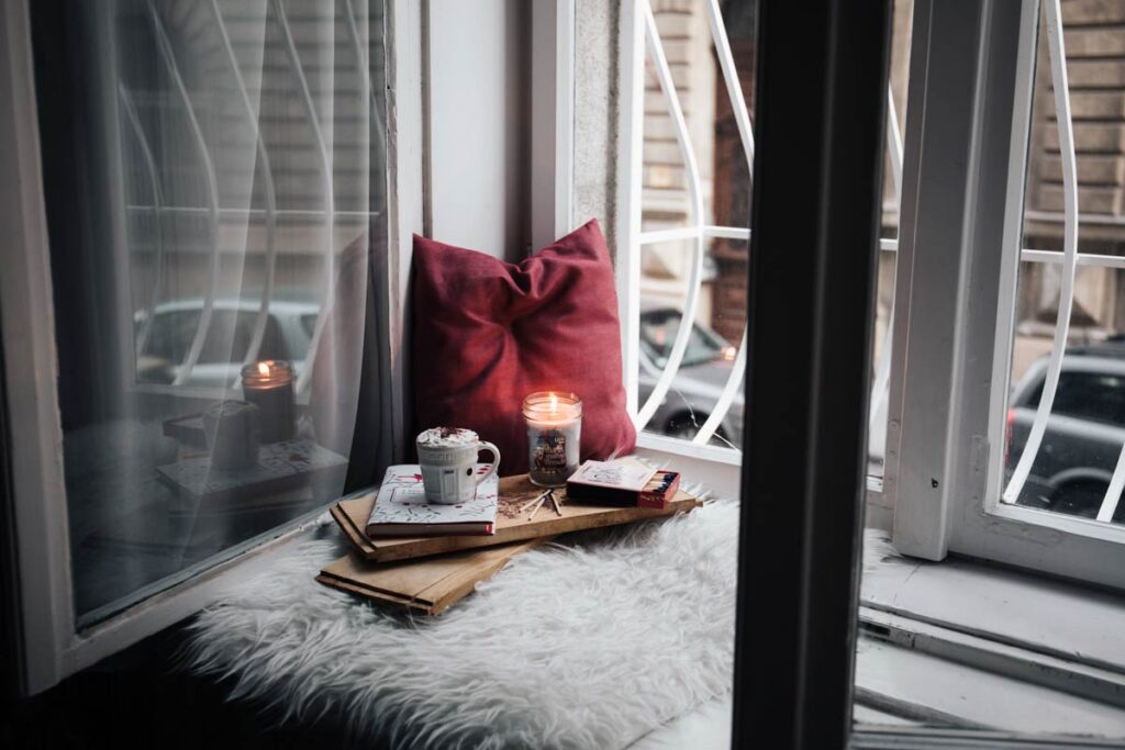 New Year's Resolutions ideas should involve a comfy spot like this, candles and self love