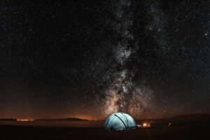 The stars shown spectacularly over a lit tent