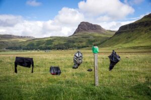Improvised drying of clothes while camping on a fence