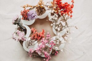 The new DIY Easter egg wreath is shown from above, each egg glued in a circle with flowers coming out.
