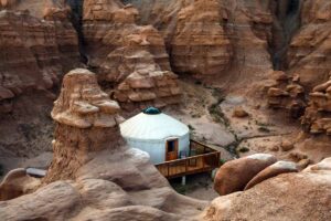 A glamping yurt nestled amongst the rocks of Goblin Valley State Park
