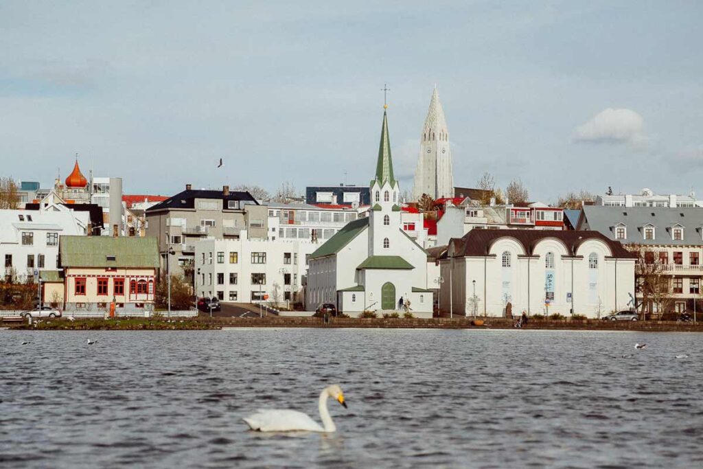 Reykjavik as seen from a lake, one of the best places to visit in November
