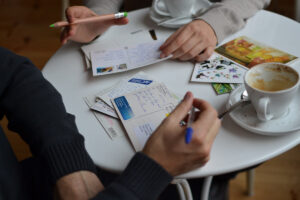 People writing postcards to pen pals they've matched with