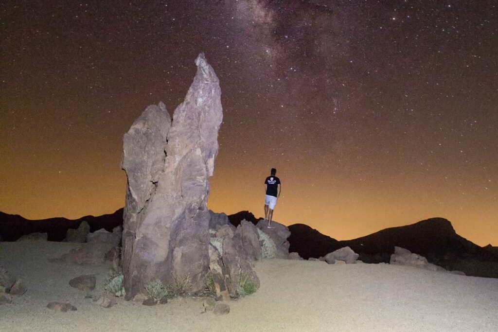 Mount Teide shows off starry skies just after dusk in this rocky landscape