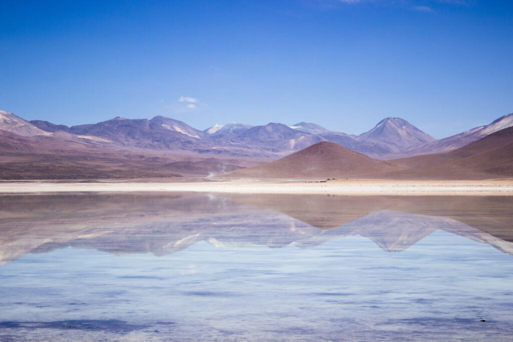 The salt flats in Bolivia reflecting the mountains make for one of the most unique views in the world