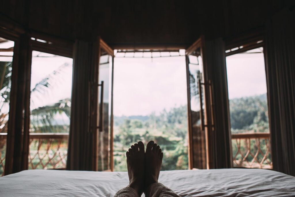 A view of someone's legs in front of a vacation cabin