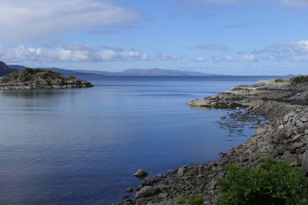 A view of Eigg over blue water