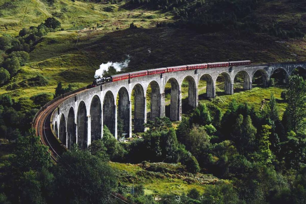The Jacobite going over the bridge from the famous scene in Harry Potter, as the Hogwarts Express and a must on this travel bucket list.