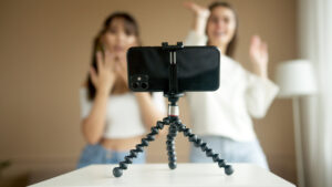 Two girls dancing on camera for their birthday video idea