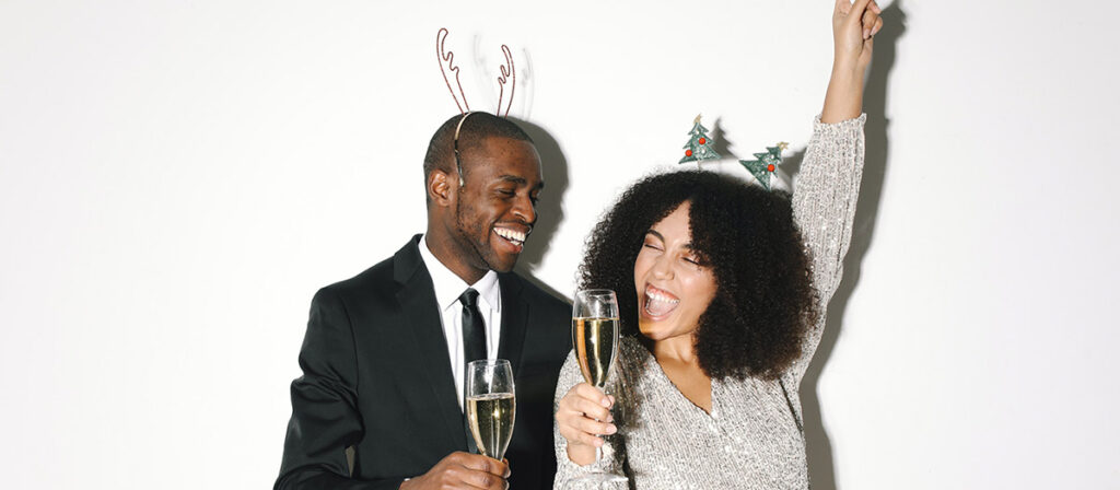 A couple celebrate the New Year together with champagne