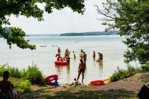 Date ideas for first or second date - a lake with people swimming and having fun