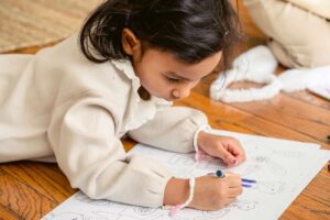 A child coloring in a coloring book