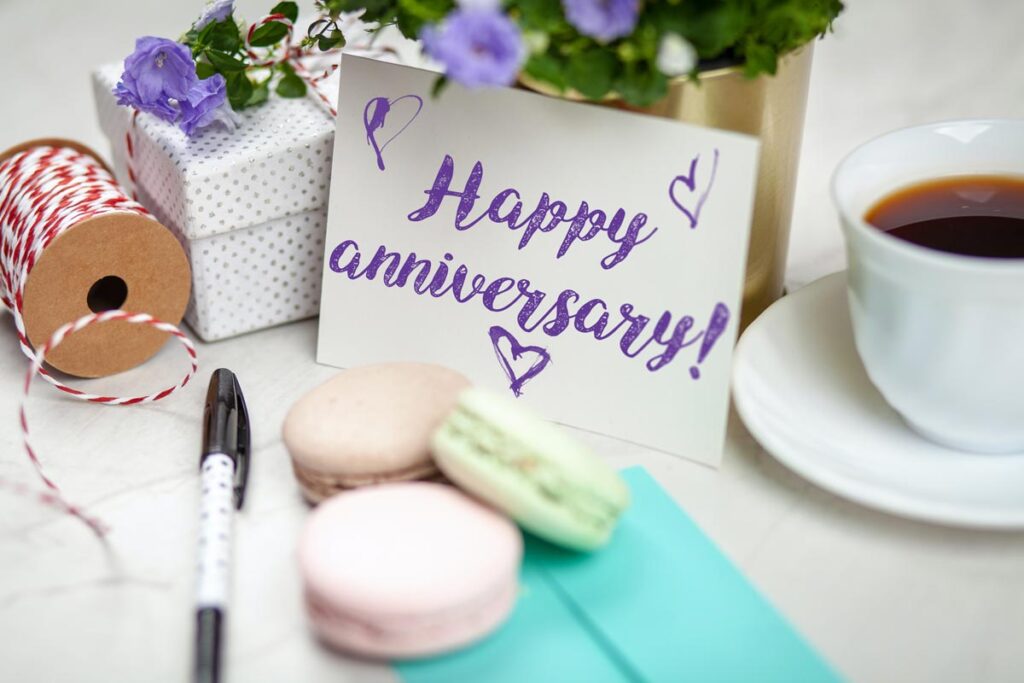 A photo of a card that says 'Happy Anniversary!'