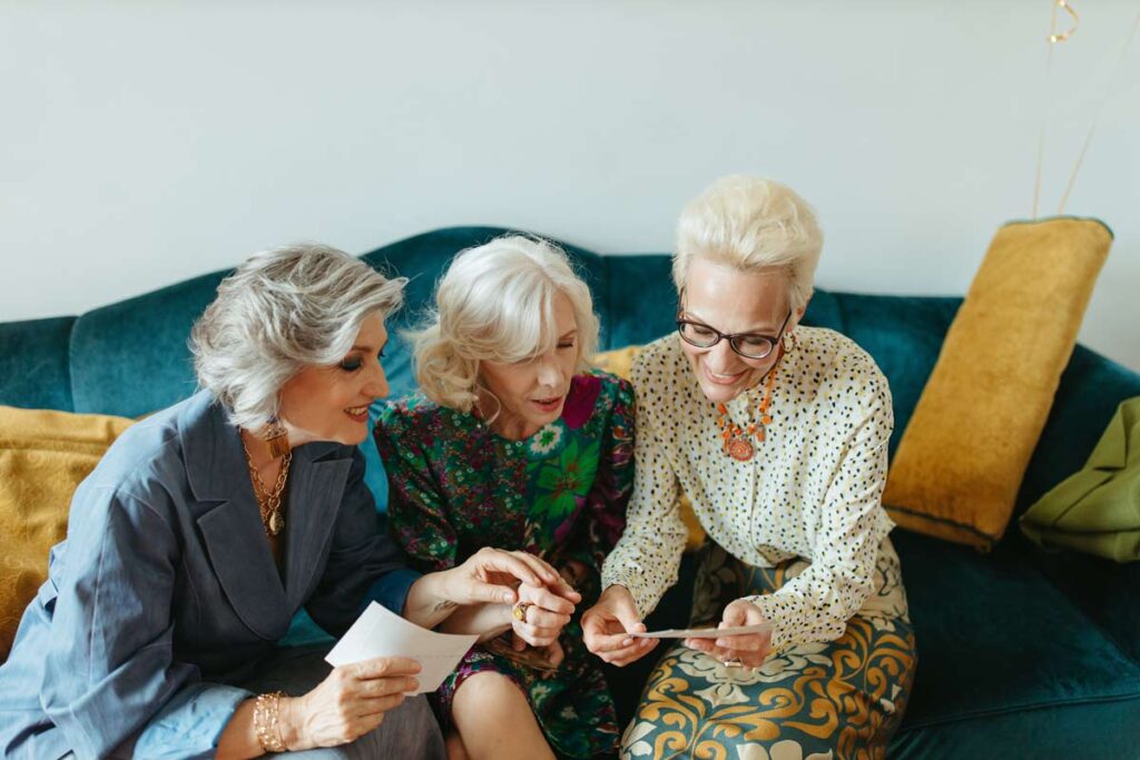 Three women look at old memories