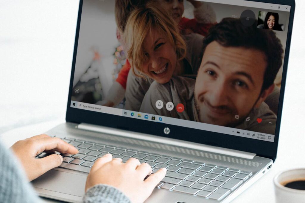 A laptop showing a video call with a dad on Father's Day